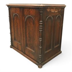 Victorian mahogany low cabinet, shaped rectangular top fitted with two arch panelled doors flanked by turned pilasters, enclosing two shelves and fitted with four short drawers with turned knobs 
