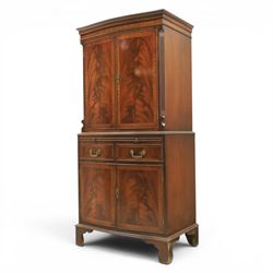 Georgian design mahogany cocktail drinks cabinet, bow fronted with mirrored and maple interior, slide out mirrored serving area, over two drawers and a cabinet below, raised on bracket feet