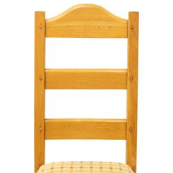 Late 20th century set of four light oak dining chairs, with green and red upholstery, on square supports united by H-stretcher 