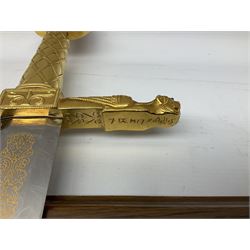 Sword of Charlemagne, gold leaf lion headed handle with gold etched stainless steel blade and with oak mounting board, H114cm