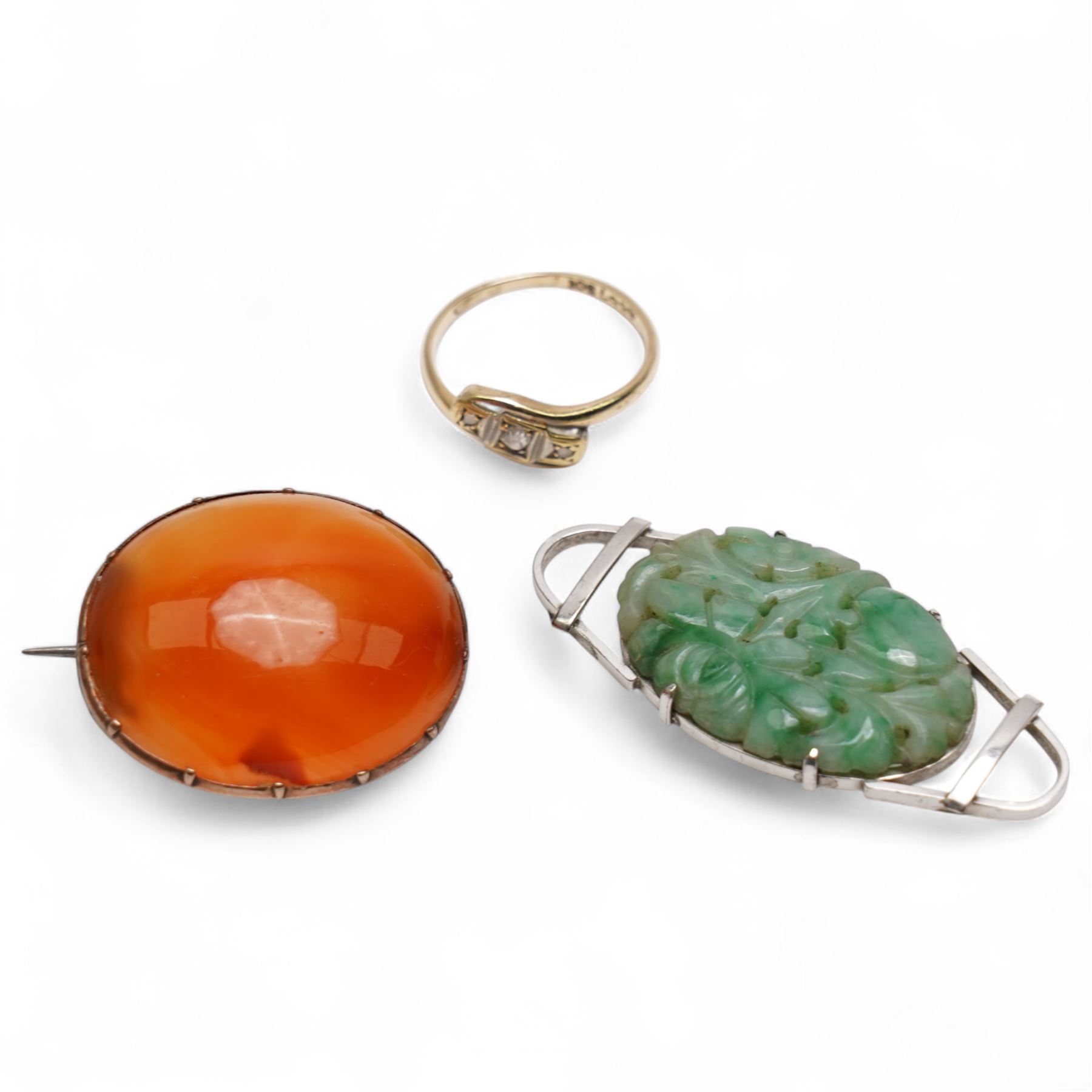 9ct white gold jade buckle / brooch, 9ct gold three stone diamond ring, stamped and an 8ct gold agate brooch