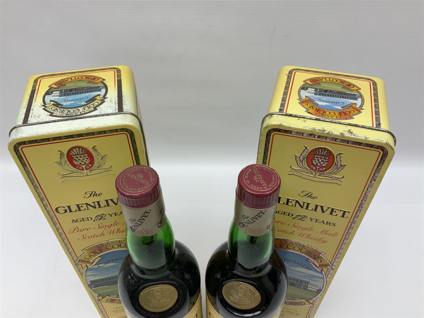 Two Glenlivet 12 year old, single malt Scotch whisky, 700ml 70% vol, each in original Classic Golf Clubs of Scotland Carnoustie presentation tin