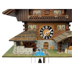 An automaton musical cuckoo clock with a 20th century three weight movement in the form of a Swiss Chalet with a working waterwheel, traditional dial and hands, thirty-hour movement with a cuckoo sounding the hours and half hours on twin bellows, hours followed by one of three tunes played on a musical box and the revolving of the water wheel. With pendulum and weights.




