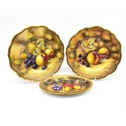 Pair of Royal Worcester hand painted plates, decorated with fruit upon a mossy ground, with gilt rims, signed J Smith, D20cm, together with a  Royal Worcester hand painted oval dish or tray, similarly decorated, signed N Creed, L18.5cm, each with black printed mark beneath. 