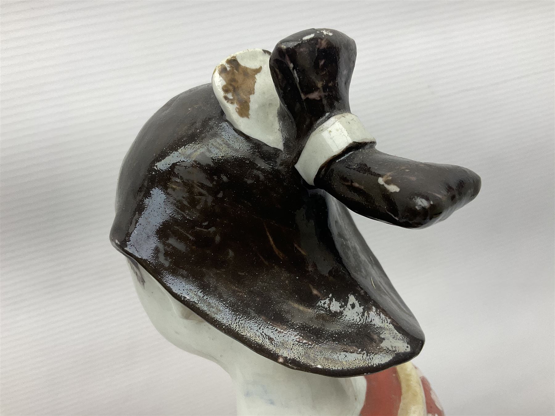 Large Japanese Imari porcelain figure, modelled as a Bijin, wearing a long kimono decorated with apple blossom and leafy branches on a white ground, with gilt detailing, possibly Edo period, H63cm