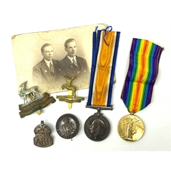 WW1 pair of medals comprising British War Medal and Victory Medal awarded to 1708 Pte.J.A. Hankins Hunts.Cyc.Bn.; two cap badges for Huntingdonshire and Royal Warwickshire 1st Birmingham Battalion; silver ARP badge; and Services Rendered badge No.B748 with photograph of recipient wearing it.
