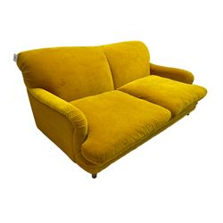 Loaf - large two seat 'Jonesy' sofa, upholstered in mustard velvet fabric with sprung back and loose seat cushions, raised on pale oak turned supports