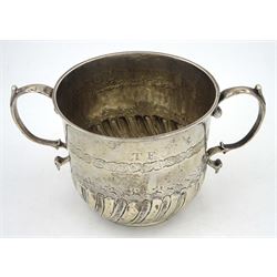 William & Mary silver porringer, the part fluted body with twin scroll handles, chased borders and initialled TF, SD and dated 98, also inscribed beneath with date of 1698, hallmarked Katherine Mangy, Hull, circa 1697, H8cm, approximate weight 4.46 ozt (138.8 grams)