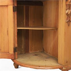 Victorian pine chiffonier, shaped moulded top with raised scroll carved back surmounted by carved fruit and foliate crest, fitted with two frieze drawers over two panelled cupboard doors, the outer cupboards of bowed form, carved foliate corbels, on plinth base