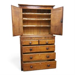 Georgian oak and mahogany housekeepers cupboard, the upper section with projecting cornice, crossbanded and inlaid frieze, above panelled doors with bone escutcheons, enclosing three fixed shelves, flanked by barley twist quarter pilasters, the lower section with further crossbanded and inlaid frieze, two short over two long graduating drawers with ebonised handles, raised on turned supports 
