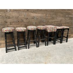 Seven tall bar stools with upholstered seat