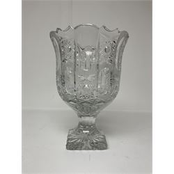 Heavy cut glass vase, decorated with pinwheel stars raised upon pedestal foot with star cut base, H28cm