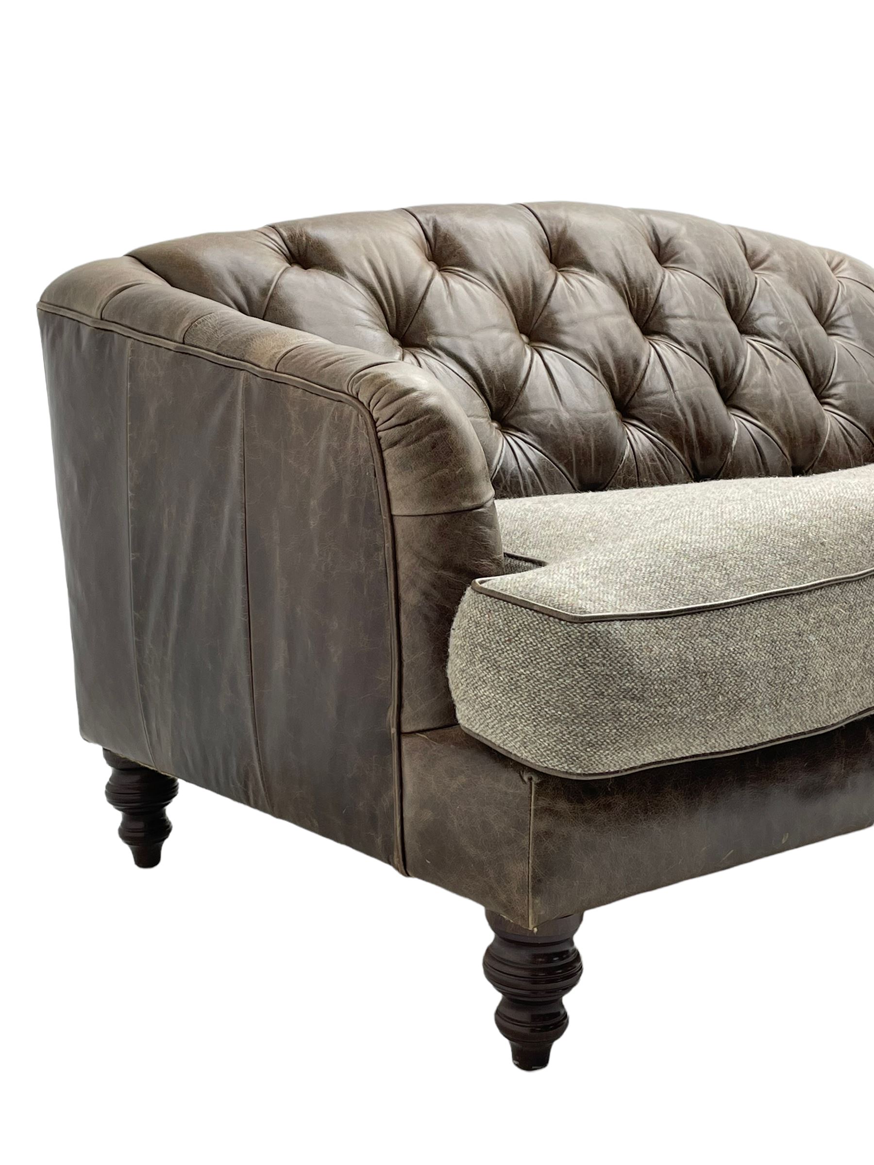Tetrad - 'Dalmore' traditional shaped two seat sofa, upholstered in buttoned brown leather with contrasting wool seat cushions, together with scatter cushions, on turned front feet