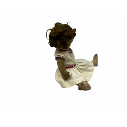 1920s Chad Valley 'Bambina' doll, the pressed felt head with applied hair, side glancing inset glass eyes, painted facial features and velvet jointed body, Hygenic and Bambina labels to the feet H46cm