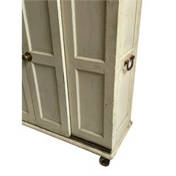 Victorian painted pine huffer or plate warmer, two sliding panelled doors enclosing shelves, panelled sides with wrought metal carrying handles, on metal and wooden castors