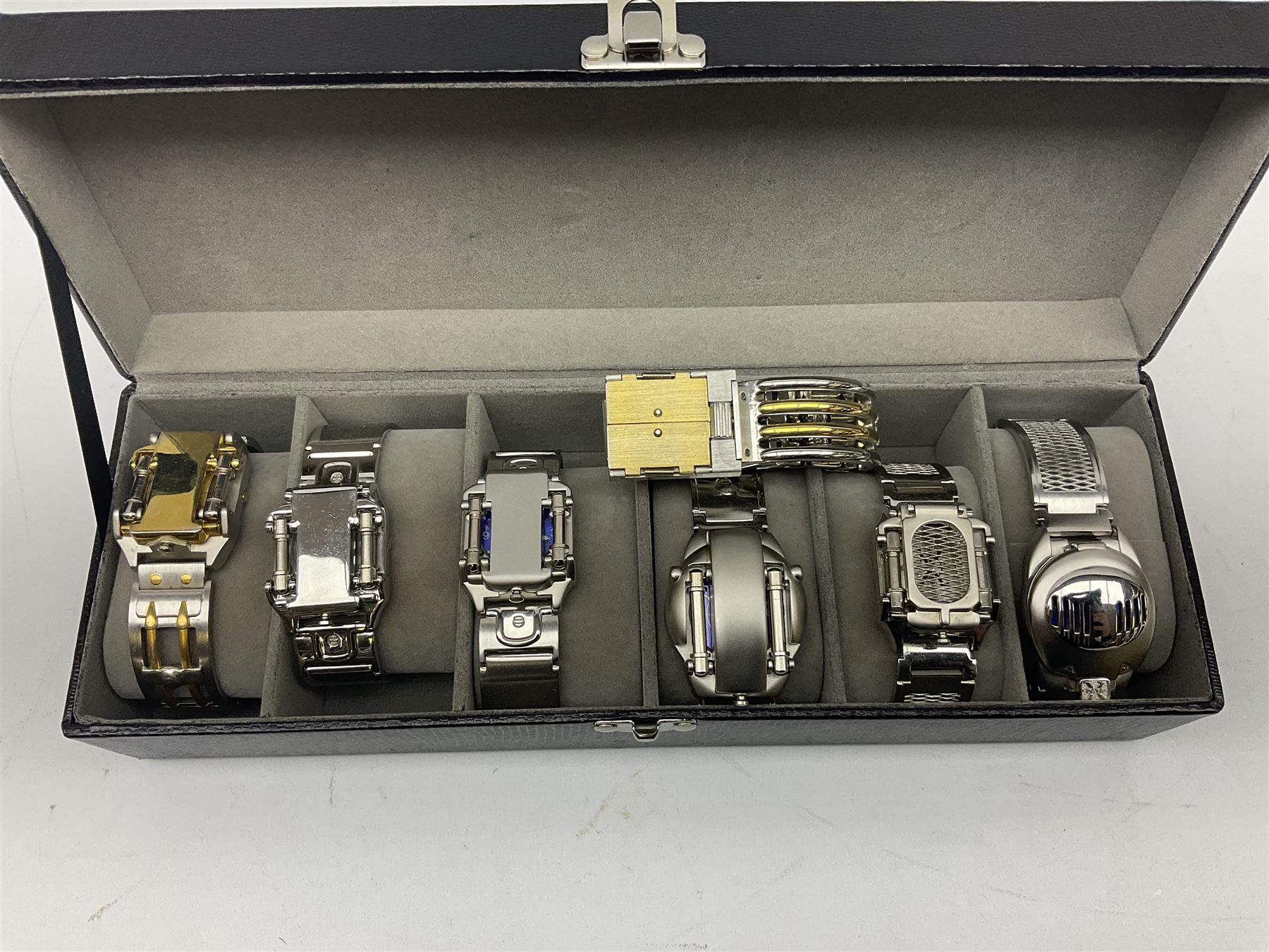 Four X Data stainless steel wristwatches, two Marc Gay wristwatches and one other, all with cover plates