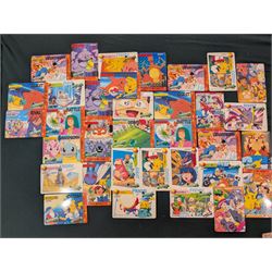 Collection of Pokemon TGC trading cards, including two WB First Movie Black Star promo cards Pikachu no. 4 and Dragonite no. 5, two Ancient Mew Black Star holo promo cards, Gym Challenge Giovanni's Persian 8/132 holo and a small collection WOTC, Neo Discovery and Neo Genesis cards, together with thirty four Bandai Carddass Pokemon cards, including prism Charizard no. 186 and Pokemon Topps cards including holo examples 