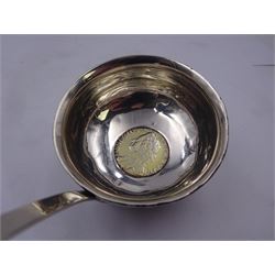 George III silver toddy ladle, the silver circular bowl engraved with monogram and inset with George II 1758 shilling to centre, upon a baleen twist handle, unmarked but testing as silver, H46cm
