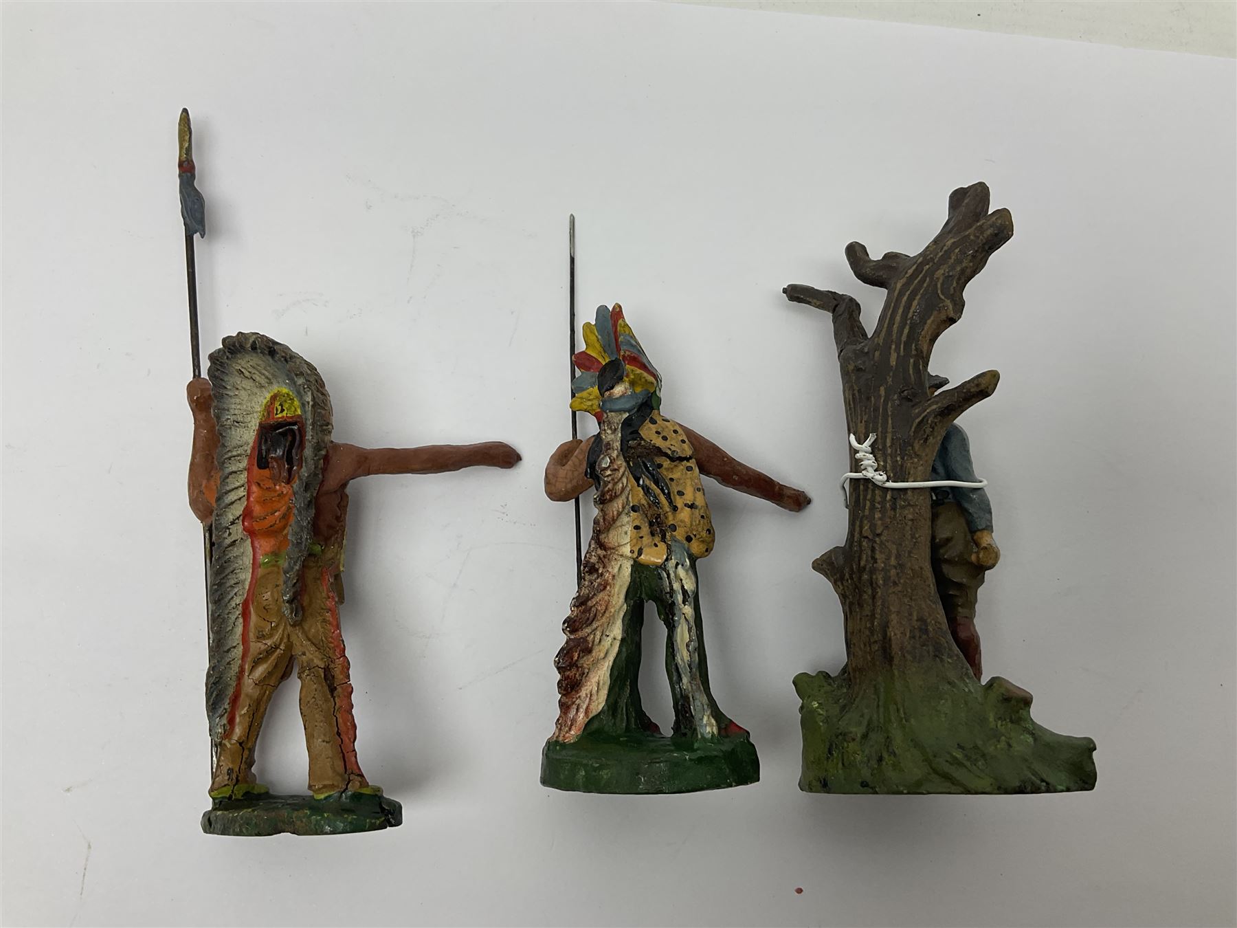 Five Elastolin American Indian figures, together with an Elastolin campfire and a cowboy tied to a tree, tallest H11cm