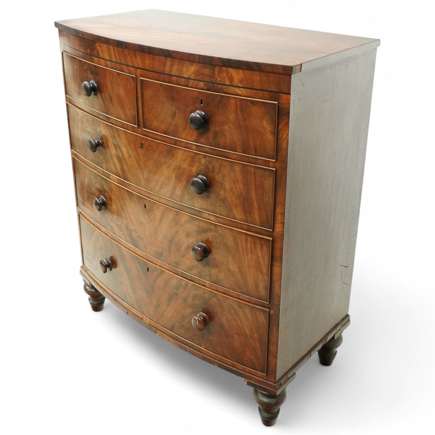 19th century mahogany chest of drawers, bow fronted form with two short over three long drawers, each veneered in matched flame mahogany, on turned feet
