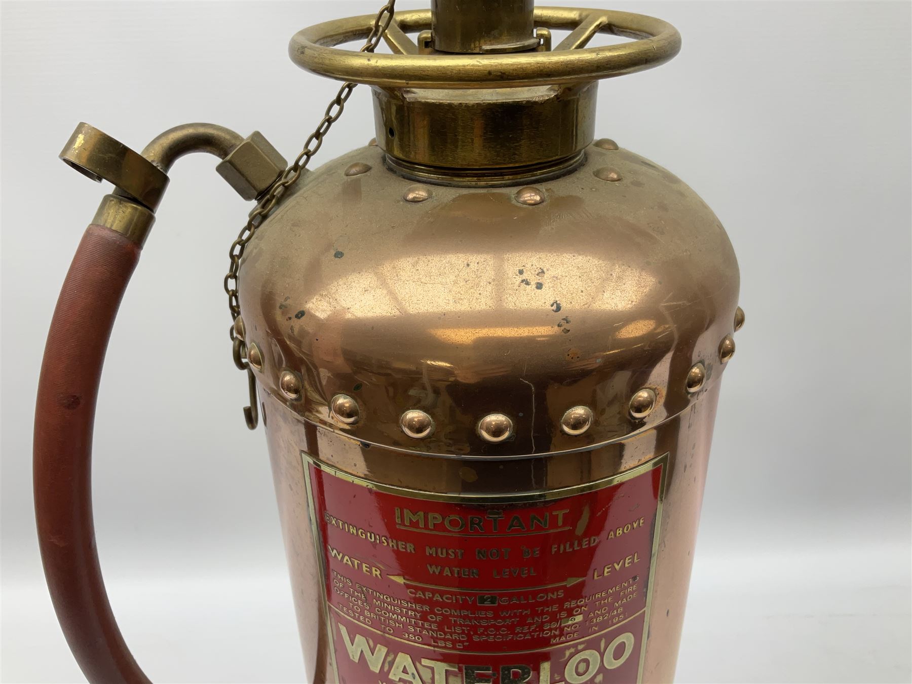 Large copper ‘Waterloo’ fire extinguisher by Read and Campbell Ltd and another Safex example 
