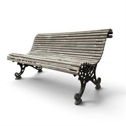 19th century cast iron and wood slatted garden bench, serpentine scroll form, ornate bow ends finished in green paint
