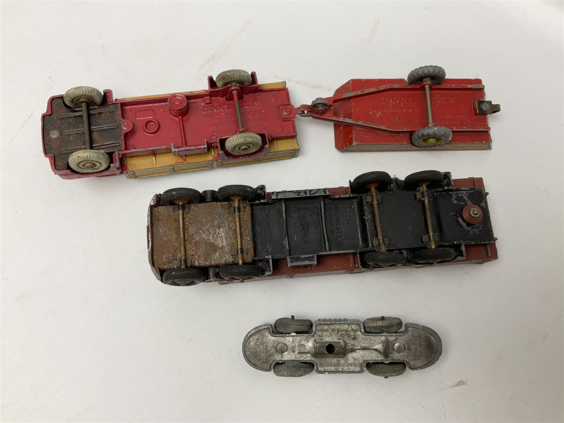 Dinky - sixteen unboxed and playworn die-cast models including Foden lorry, Big Bedford lorry with Halesowen Farm Trailer, Thunderbolt land speed record car, Spirit of the Wind racing car, market garden truck, Bedford tipper, station wagon, tanker, motorcycle combination etc; two Corgi models; and five Matchbox/Lesney models (23)