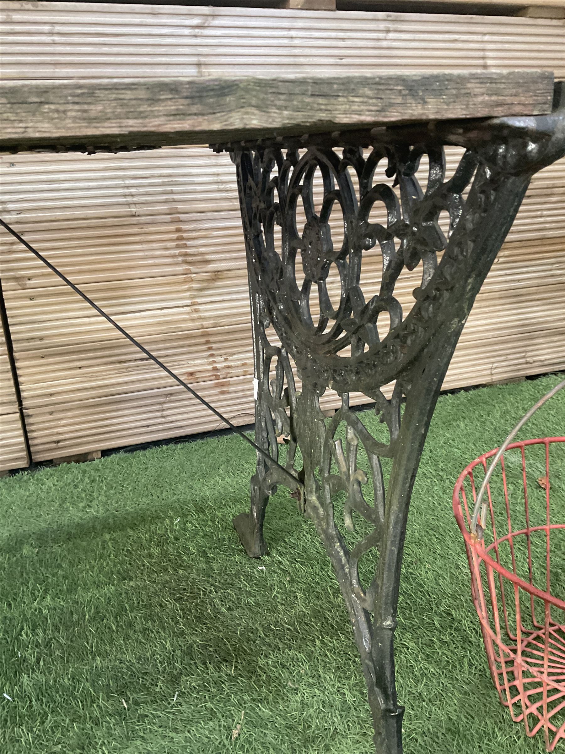 Cast iron and wood slatted garden table and pair of metal hanging baskets  - THIS LOT IS TO BE COLLECTED BY APPOINTMENT FROM DUGGLEBY STORAGE, GREAT HILL, EASTFIELD, SCARBOROUGH, YO11 3TX