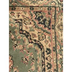 Pair of Bangladeshi olive ground runner rugs, machine-made with 100% jute pile, each with three central diamond-shaped medallions with intricate floral motifs, the field decorated with scrolling floral designs, bordered by stylised floral patterns 