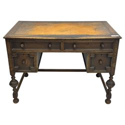 Early 20th century Jacobean design oak desk, with rectangular top inset with worn tooled leather, two frieze drawers over pedestals each fitted with a pair of panelled drawers, turned handles, on carved and fluted tapering legs united by stretchers 