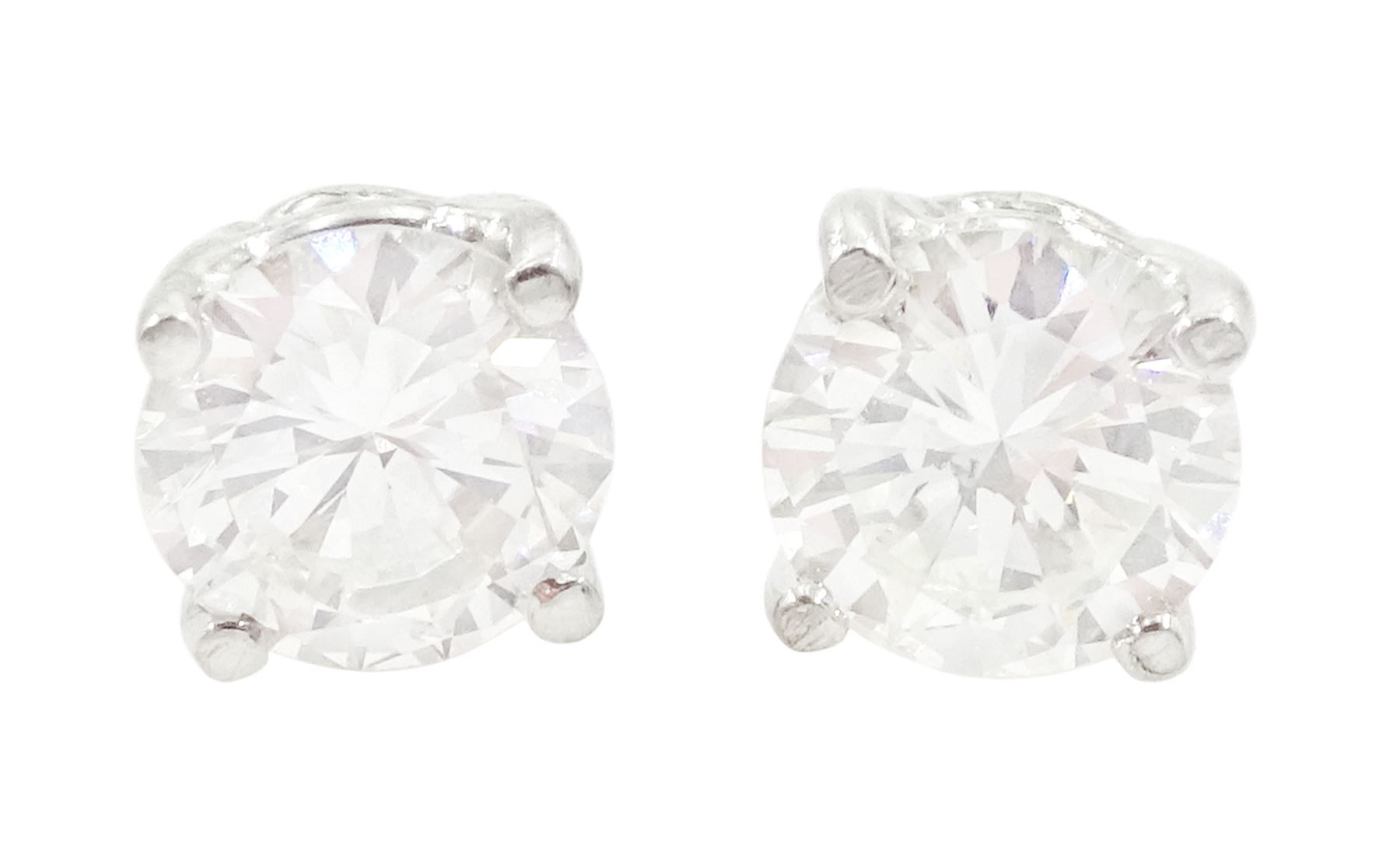 Pair of 18ct white gold round brilliant cut diamond stud earrings, total diamond weight approx 1.20 carat