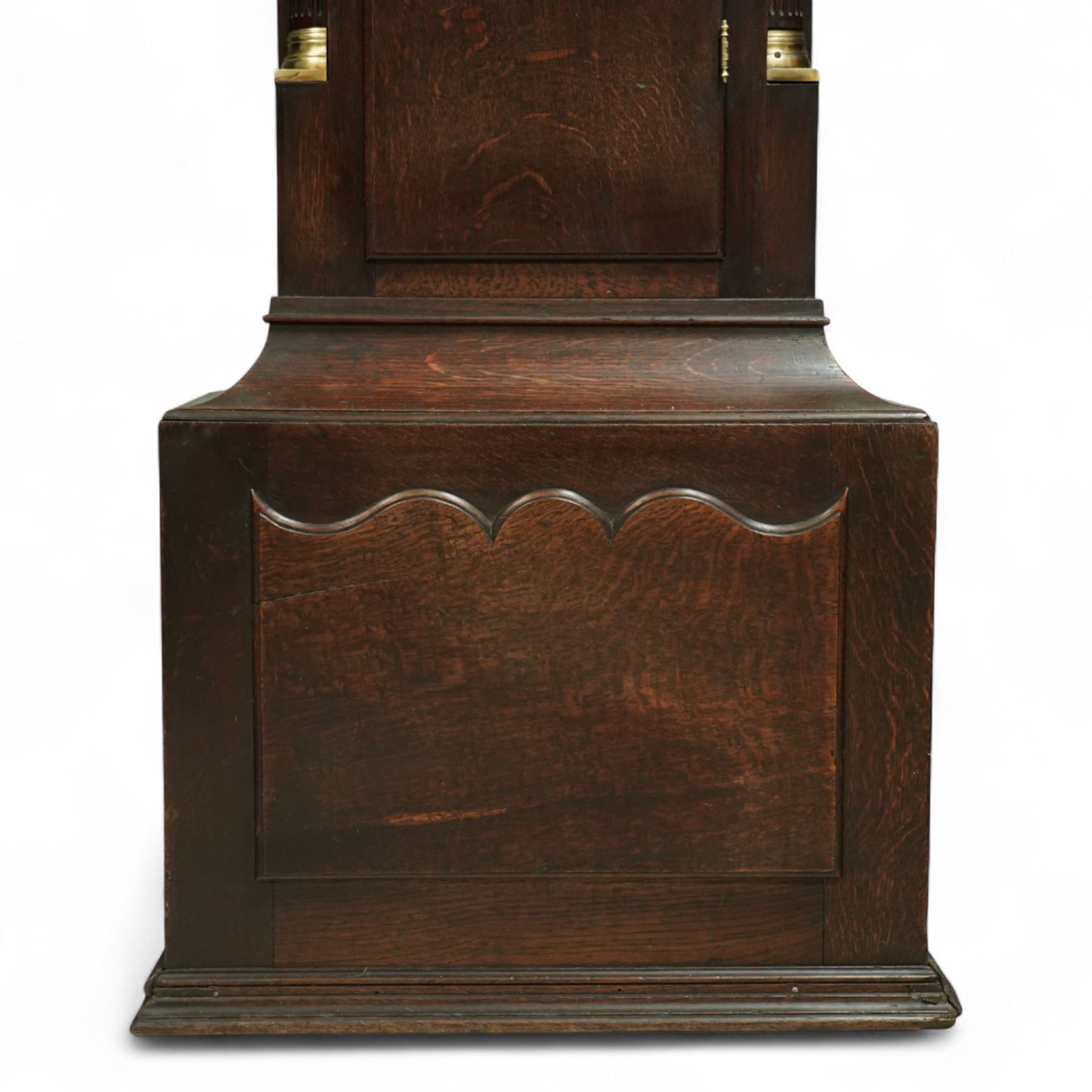 Lister of Halifax -  Oak cased musical longcase clock c1790, 8-day movement sounding the quarters and hours on bells or gong rods, case with a flat pediment and oval  conch inlay beneath, break arch hood door with reeded pilasters and brass Corinthian capitals, trunk with conforming quarter recessed pillars and a long wavy topped door, plinth with a raised panel and applied moulding the the base, break arch brass dial with cast spandrels and engraved dial centre, with a silvered chapter, seconds dial and cartouche with makers name, gongs or bells selector to the arch, chapter with Roman numerals, five minute Arabic's, minute track and steel moon hands, dial pinned directly to a three train weight driven movement with a nest of eight bells and eight gong rods, sounding the hours on either bells or gong rods, with a rack strike and recoil anchor escapement. With pendulum and weights.
The Lister family were a prodigious family of prolific clockmakers working in Halifax and the West Riding area of Yorkshire during the 18th and 19th century, well-known and noted for producing a number of chiming and musical longcase clocks.