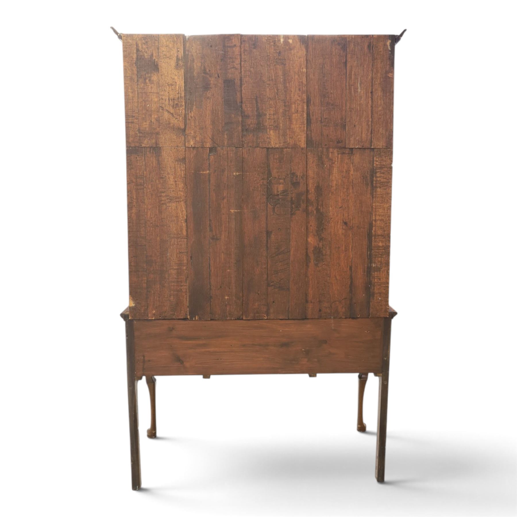 Late 19th century inlaid oak dresser and plate rack, plate rack with projecting cornice and fretwork, with three shaped shelves for plates, central cupboard with inlaid shell and border, brass escutcheon and key, the lower section with crossabanded top, above three drawers with brass handles and inlaid border, shaped apron raised on cabriole supports 