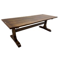 Dorset Oak - large refectory dining table, rectangular plank top, raised on shaped end supports with sledge feet, united by stretcher
