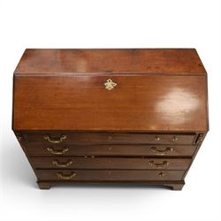 George III mahogany bureau of large proportions, the fall-front enclosing fitted interior with fluted column secret compartments and assorted pigeonholes and correspondence drawers flanking central cupboard, over four graduating cock-beaded drawers with original brass swan-neck handles, raised on bracket feet