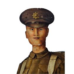 Military Outfitters hand painted life size wooden cut out figure of a WW1 soldier standing at ease holding a gun by his side, marked Stening Signs; hardboard on planked frame H199cm