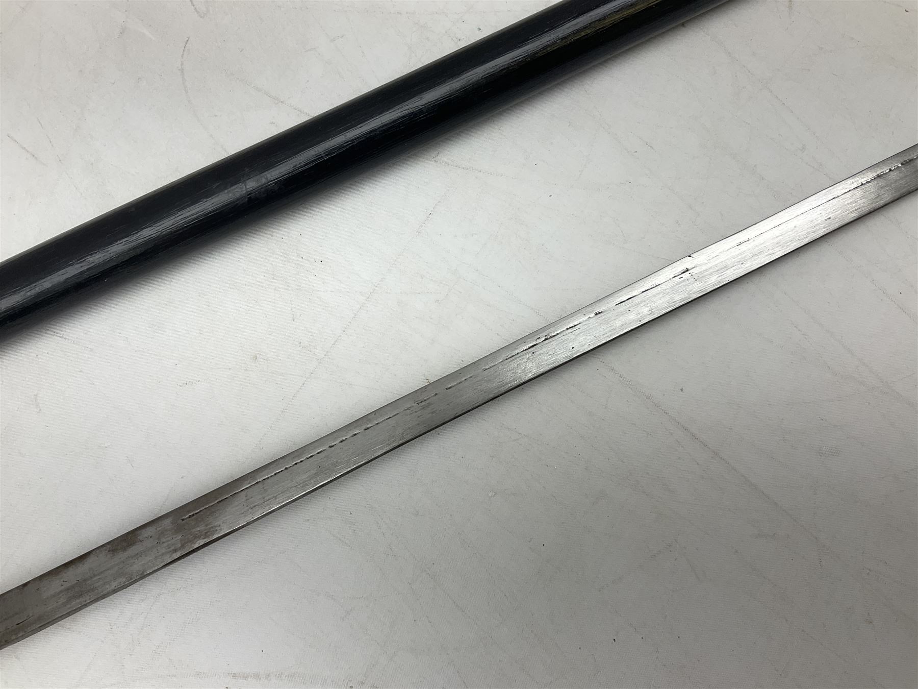 Late 19th/early 20th century Anglo Indian ebony and bone sword stick with 62cm steel blade, brass locking ferrule and lion mask pommel L92 cm.