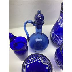 Bristol blue glass jug, together with blue claret jug, saucer, blue cut water jug, and seven matching glasses, water jug H22cm