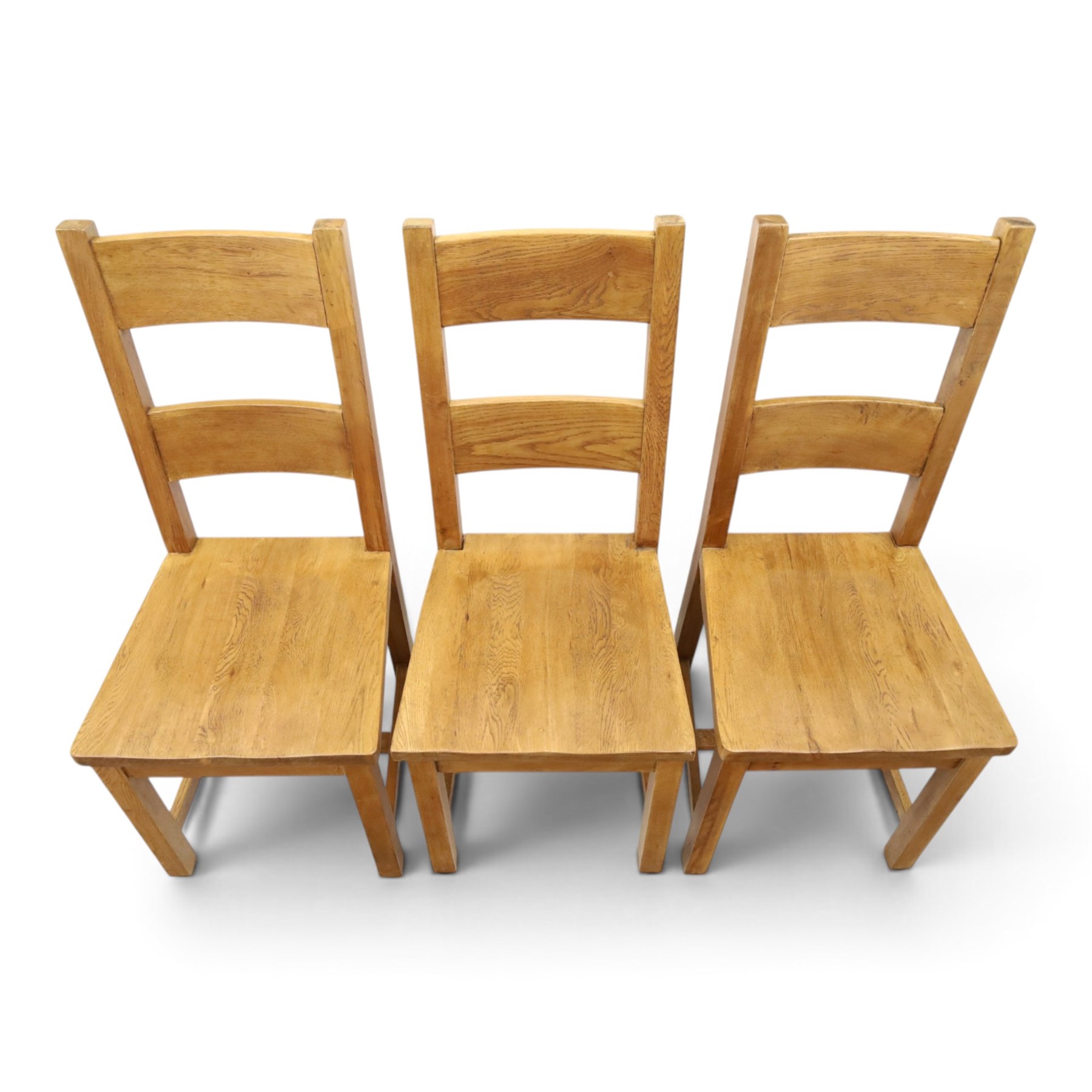 Indigo Furniture - large rustic oak dining table, rectangular four plank top raised on square supports; with set of six beech high ladder-back dining chairs