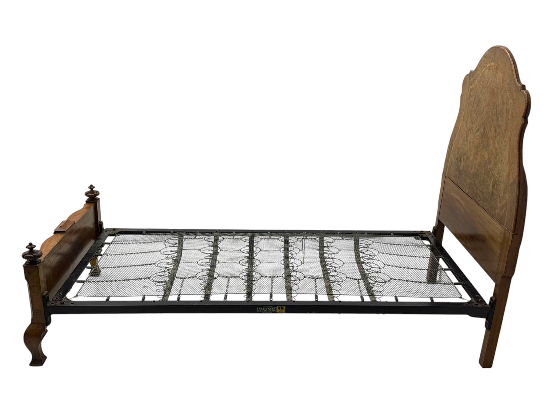 Mid-20th century walnut single bedstead, high shaped headboard, footboard with turned finials and scrollwork carvings, complete with 'Vono' iron frame, raised on cabriole supports