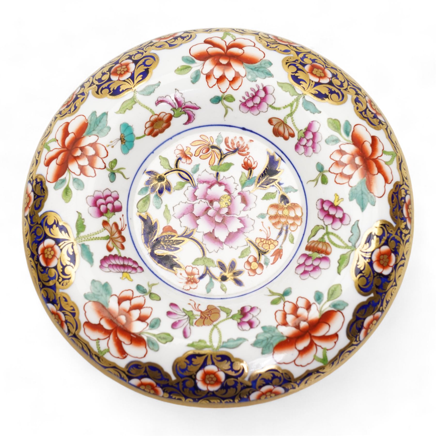 Early 19th century Spode spill vase, of cylindrical form with flared rim, hand painted with a Green Woodpecker perched on a branch, within beaded borders, titled beneath, H16cm, together with a Spode chocolate cup turnover rim stand, decorated in the imari pattern, no. 2630, painted marks beneath, D14cm (2)