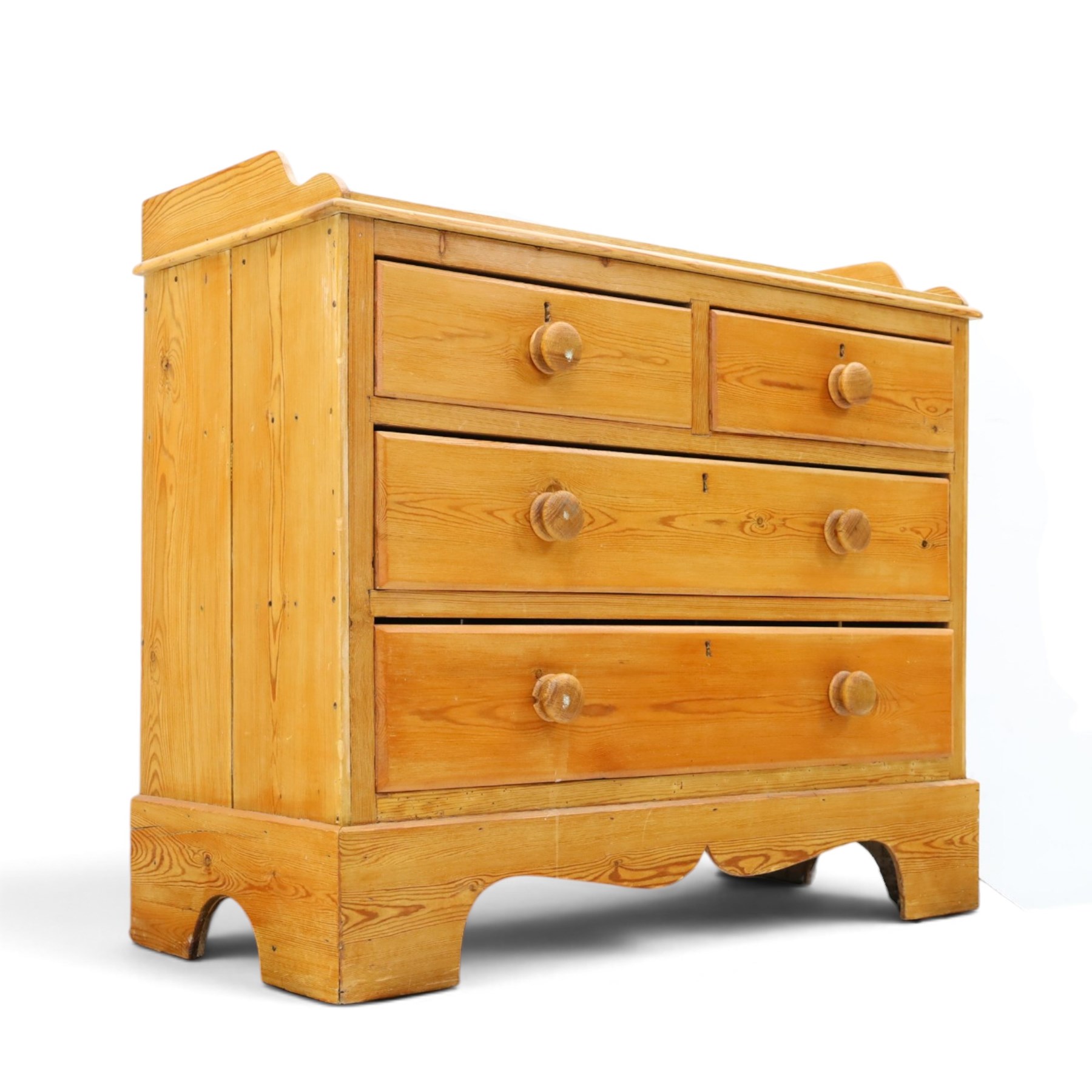 Victorian pine chest, galleried three quarter top, fitted with two short and two long drawers. with shaped apron and supports