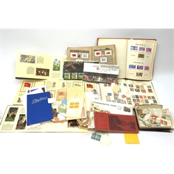 Stamps and cigarette cards including Great British first day covers, World stamps in albums, part filled 'The Kensitas Album of National Flags', loose cigarette cards etc