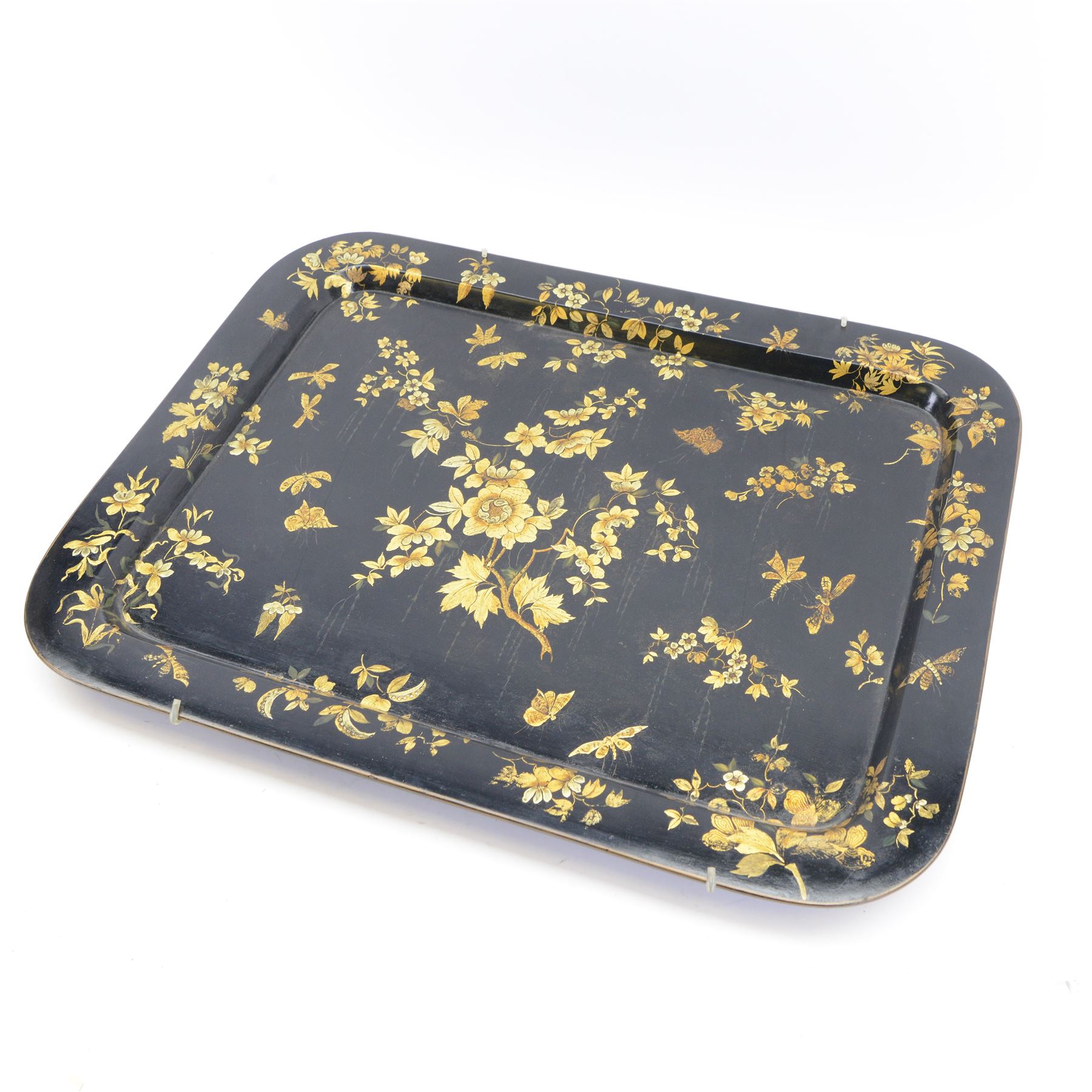 Large 19th century black lacquered papier-mâché tray, of rounded rectangular form, painted in gilt with floral sprays and butterflies, W77cm D58.5cm