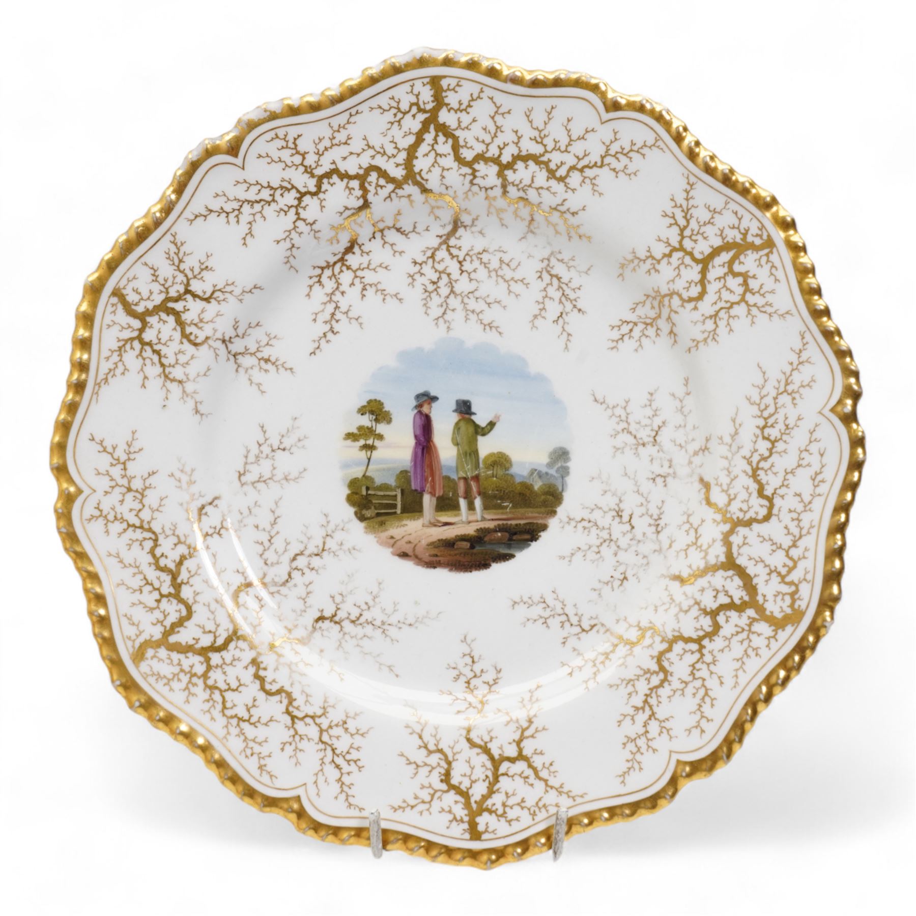 Flight, Barr & Barr Worcester porcelain cabinet plate, centrally painted with two figures admiring the landscape, within a gilt seaweed border, printed marks beneath, D22.5cm, together with a Barr, Flight & Barr Worcester cabinet plate, painted with a view of the River Esk, Scotland', within a peach and gilt seaweed border, titled 'On the River Esk - Scotland' and printed marks beneath (2)