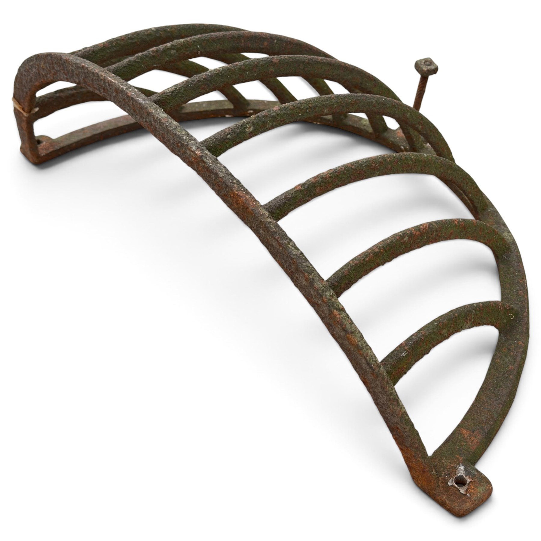 Victorian wrought iron wall-mounted stable hay rack of bowed cage form, with curved bars and fixing lugs