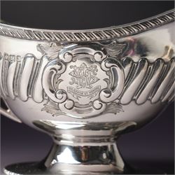 Victorian silver sauce boat engraved with a monogram Sheffield 1892 Maker John Round  & Son Ltd, another with crimped rim Birmingham 1912 Maker Elkington & Co, two silver pepperettes and a small silver challenge cup