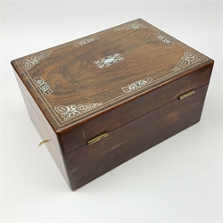 A Victorian rosewood vanity box, with inlaid foliate mother of pearl decoration, the hinged cover opening to reveal a compartmented interior with two glass scent bottles, and two glass pots with silver plated lids, L30.5cm. 