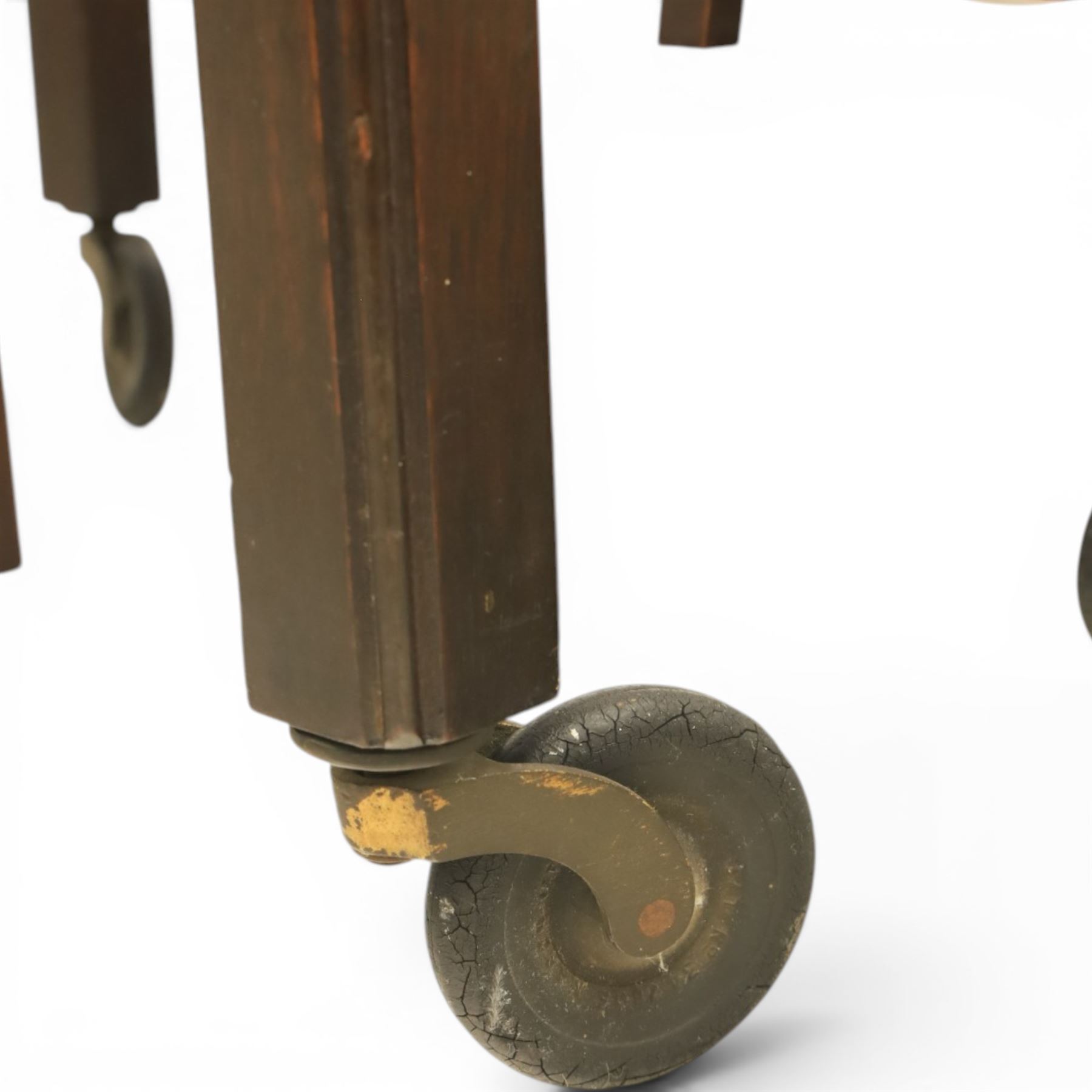 Early 20th century side table with double cake stand, rectangular moulded top, cake stands either side with support, raised on square legs terminating in castors