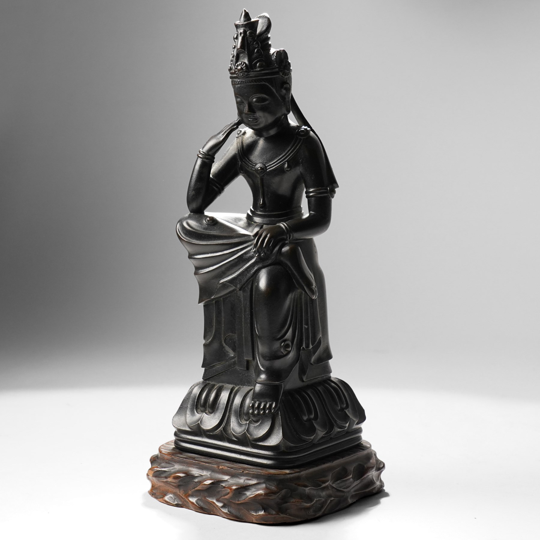 Japanese early 20th century bronze figure of Miroku Bosatsu, on naturalistic hardwood base, H31cm